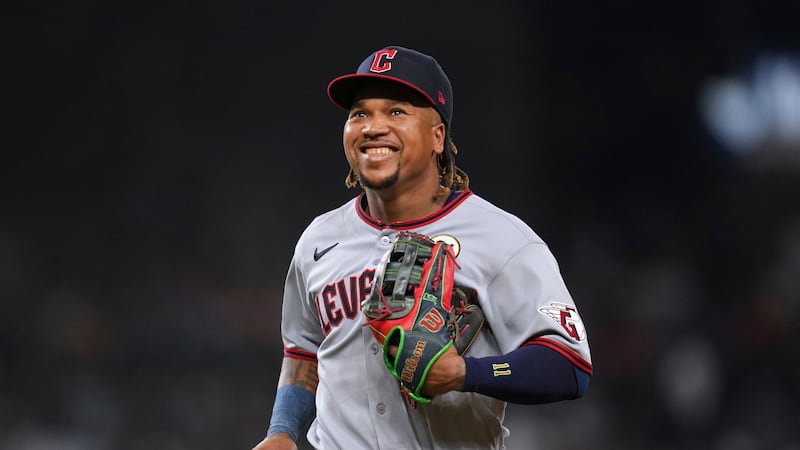 FILE - Cleveland Guardians third baseman JosÈ RamÌrez smiles against the Detroit Tigers during...