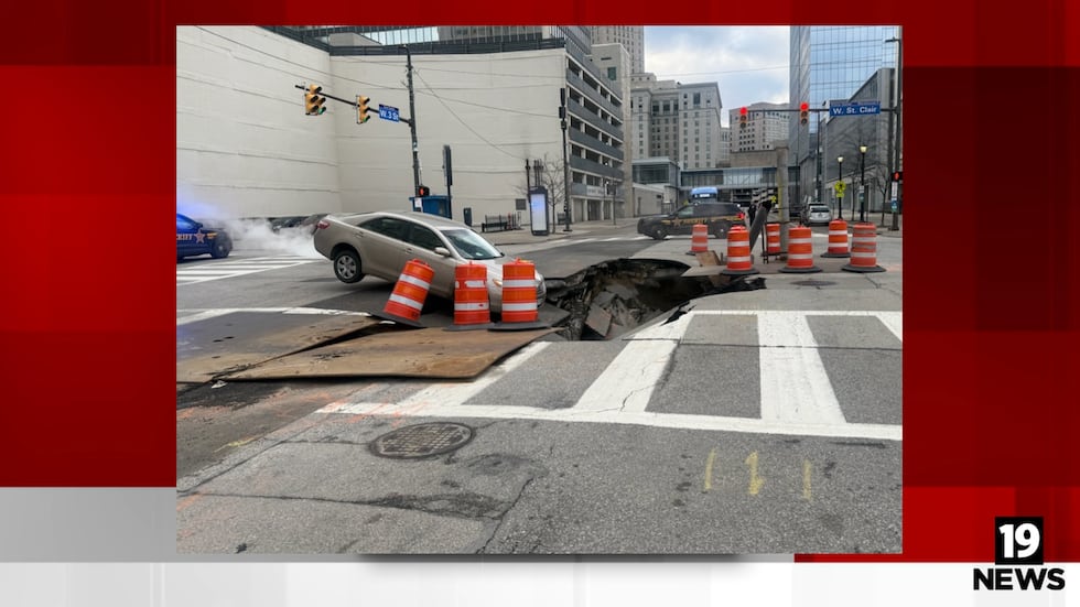 Massive sinkhole in downtown Cleveland nearly swallows car