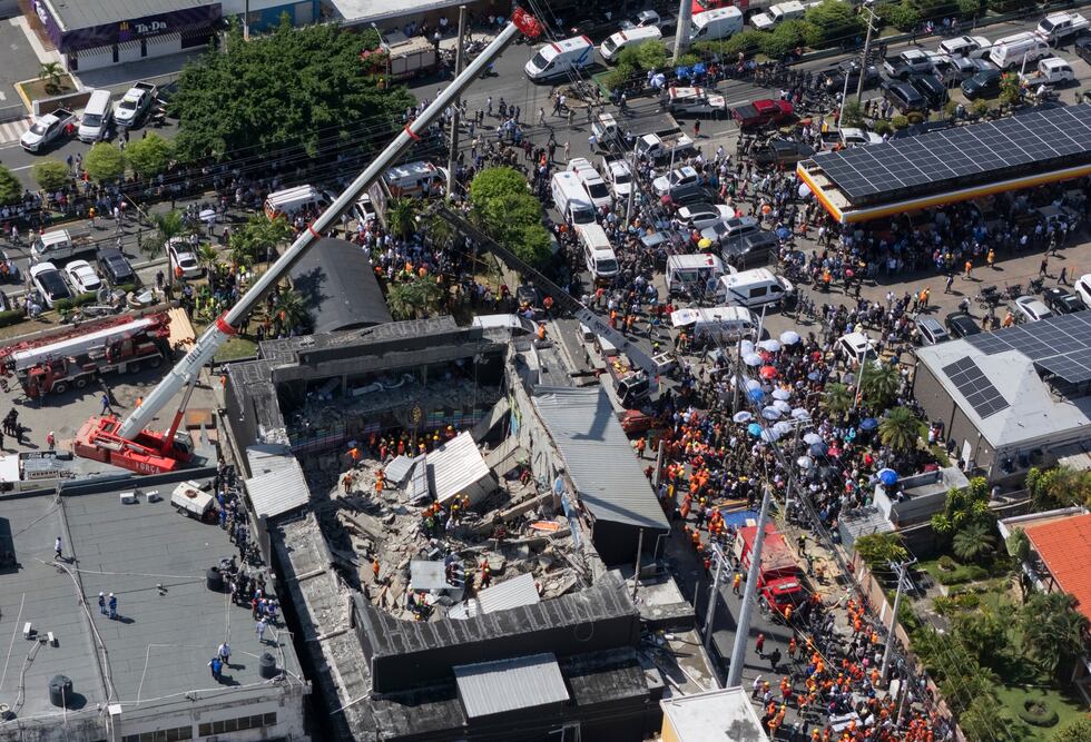 Rescue workers search for survivors at the Jet Set nightclub after its roof collapsed during a...