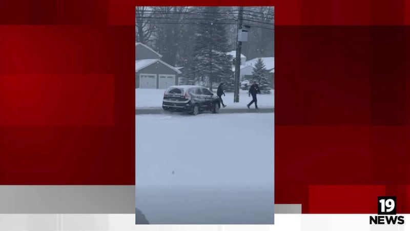 Westlake Police officers and neighbors help driver after car spins out